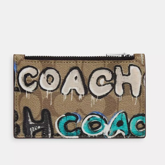 Signature coated canvas and refined pebble leather Five credit card slots Zip po - Picture 5 of 11